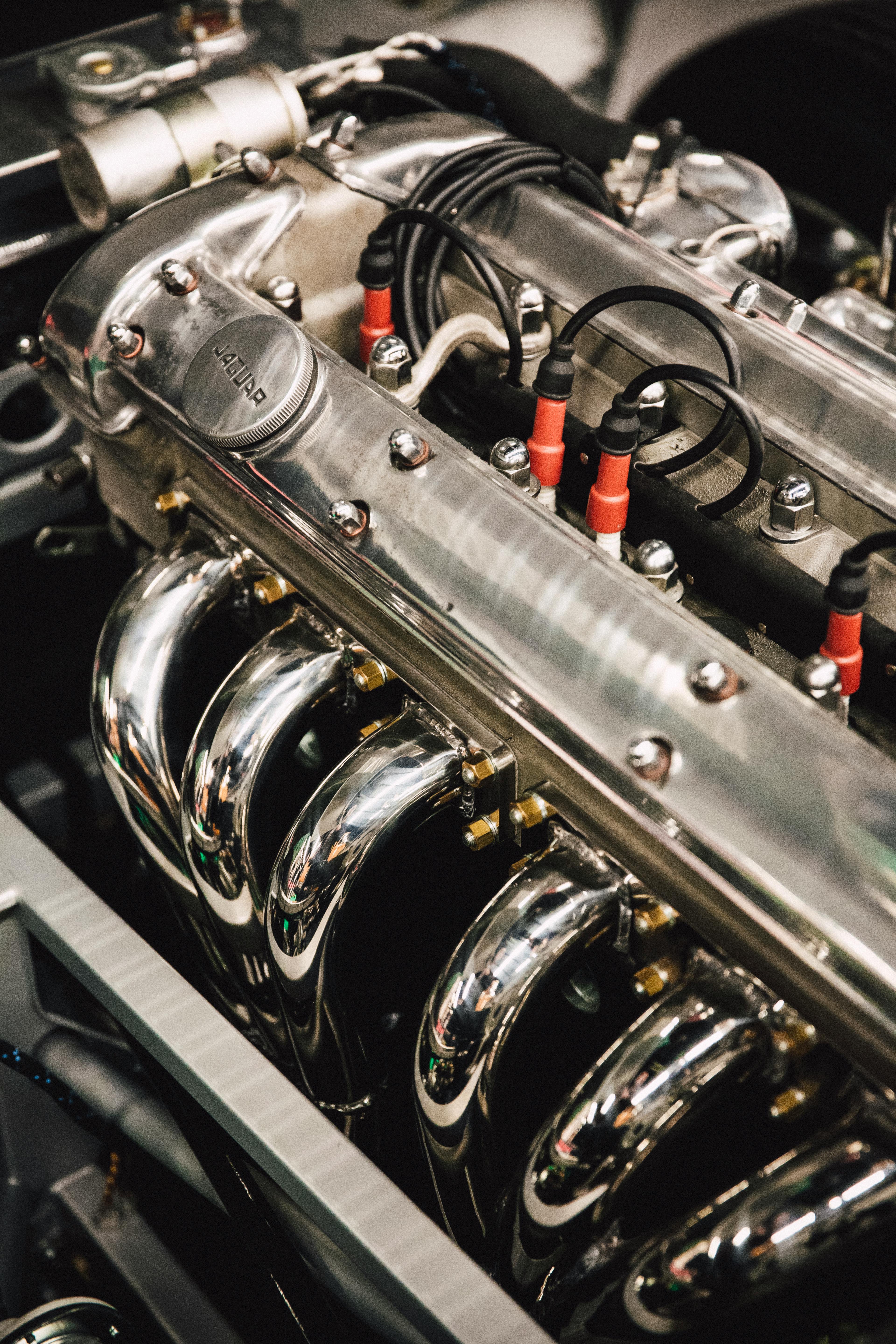 Detailed view of a polished chrome engine, showcasing luxury automotive design.